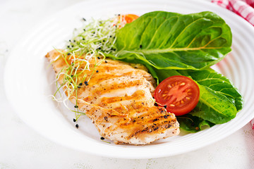 Chicken grilled fillet with salad fresh tomatoes and avocado. Healthy food, ketogenic diet, diet lunch concept. Keto/Paleo diet menu.