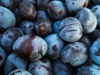 plums on a black background