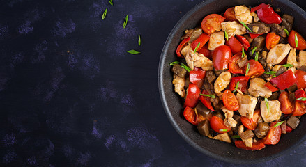 Chicken stir fry. Meat stew with vegetables sweet pepper, onion, tomato, eggplant  in soy sauce gravy. Ketogenic diet. Top view, overhead, copy space