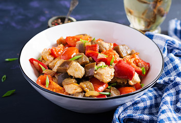 Chicken stir fry. Meat stew with vegetables sweet pepper, onion, tomato, eggplant  in soy sauce gravy. Ketogenic diet.