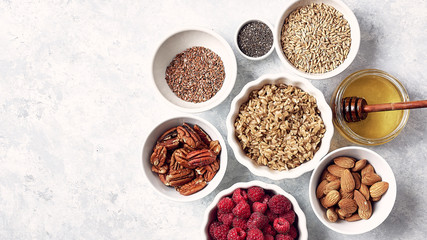 Obraz na płótnie Canvas healthy breakfast oatmeal with raspberries, figs, chia and flax