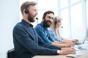 call center staff use computers to work with clients