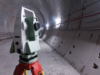 Geodetic total station in the tunnell of metro under construction