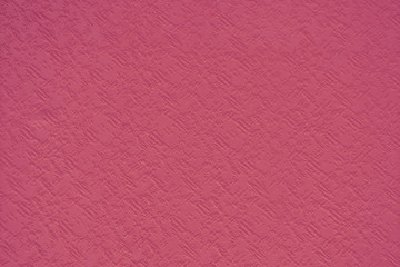 Fototapeta premium Texture of red paint on concrete wall with uneven surface, background