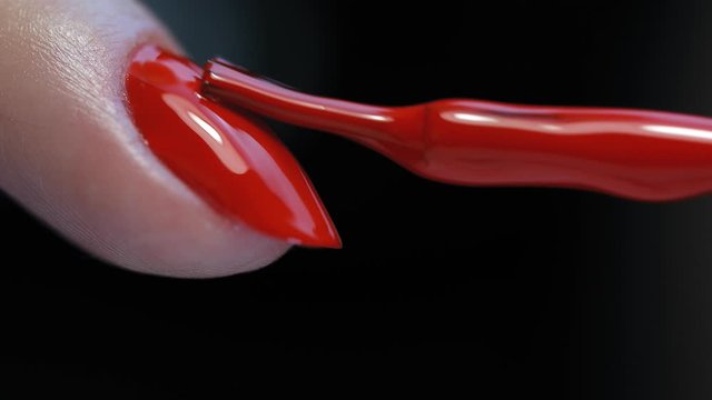 Manicure nail paint. Master applies gel polish on nails  in manicure salon. Nail polish.