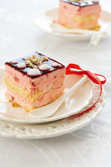 Yummy slices of strawberry cake on table, creamy dessert, holiday themes