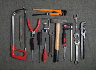   hand tools: hammer, saw, adjustable wrench, screwdriver, open-end wrenches, pliers, etc.