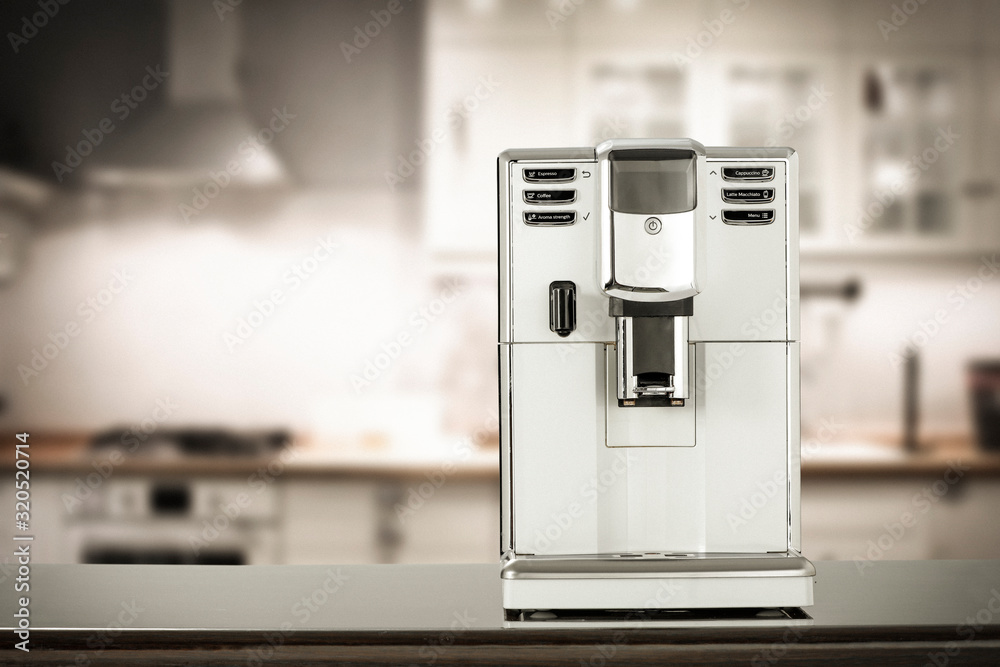 Sticker coffee machine and blurred kitchen interior.