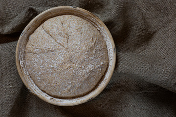 Proofing dough in a special basket. Raise the dough before baking. Yeast-free dough. The fermentation process of the dough.