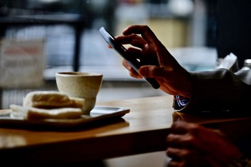 Checking the news during a coffee break.