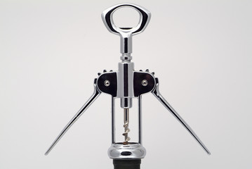 Corkscrew opening a bottle of wine