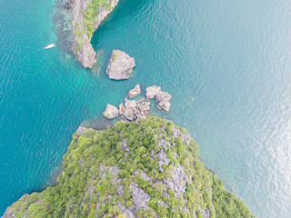 Bird's eye view of a tropical Thai island, crystal clear water and rocks