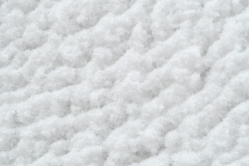 Winter snow texture. Snowy white texture. Snowflakes.