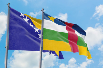 Central African Republic and Bosnia Herzegovina flags waving in the wind against white cloudy blue sky together. Diplomacy concept, international relations.