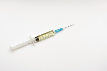 vaccination syringe with a needle on a white background. the concept of medicine.