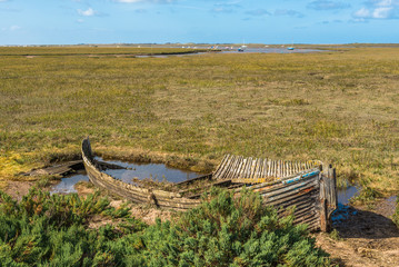 Rustic old boat left to decay on Salt Marshes between Blakeney and Cley