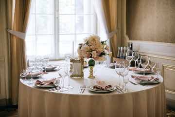 Elegant table set up for a romantic dinner. Wedding reception, catering
