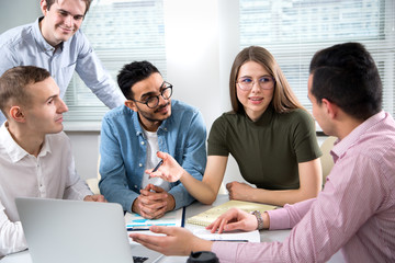 Fototapeta premium Multy-ethnic group of young business people working with computer at office