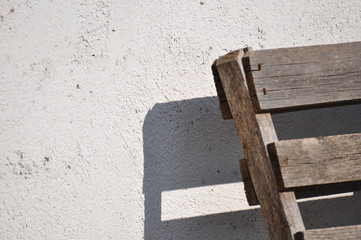 Gray wall texture and wooden object