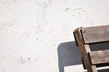 Gray wall texture and wooden object