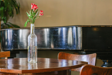 Interior with vintage brown furniture and flower on the table