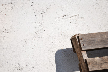 Gray wall texture and wooden object