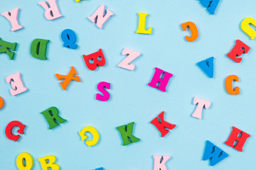 Multicolored letters on a blue background.