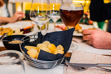 waiter serving red wine in a restaurant