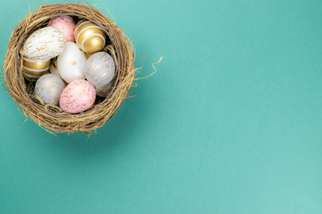 Easter background white. Easter composition: golden shine decorated eggs in basket. For greeting card, promotion, poster,