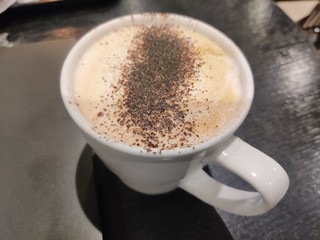 cup of coffee on black background