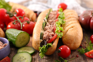 sandwich- bread with tuna fish, tomato, cucumber, salad and sauce