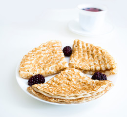 pancakes with berries on a plate
