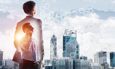 Concept of business success and control with confident boss against cityscape background
