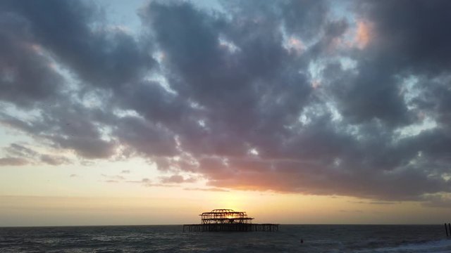 Silhouette of Brighton west pier at sunset