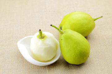 Peeled pears and peeled pears on the indoor background