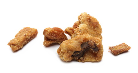 Pork cracklings, greaves isolated on white background