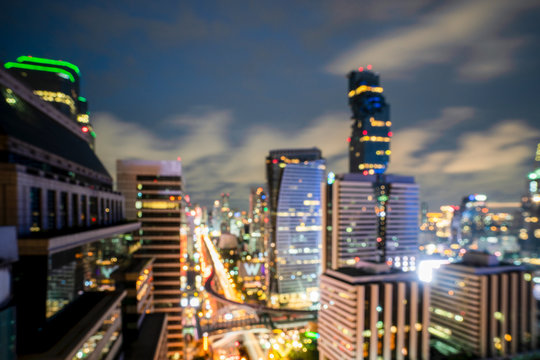 Night blurred bokeh light city office building, abstract background