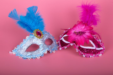 Venetian type masks on pink background. Carnival concept