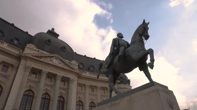 4k video of The Bucharest National Central University Library Building And Statue Of King Carol I Of Romania. Important landmark. Wide angle shot