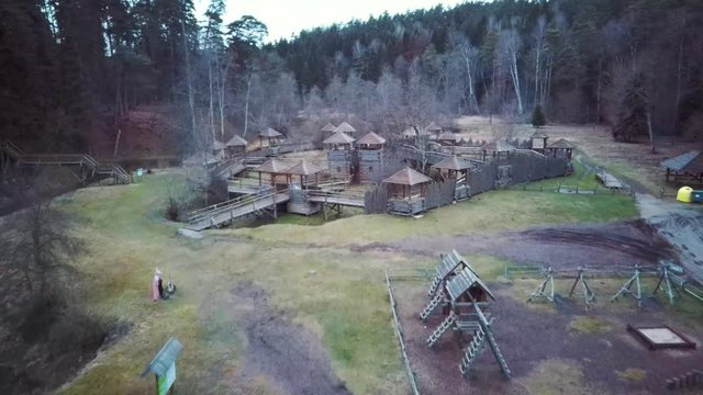  Aerial View of the Wooden Castle, Forest and River Tervete in Tervete Nature Park. Tourist Attractions in Latvia. Winter Evening Sunrise. Park in Forest With Wooden Statues of Gnomes, Monsters