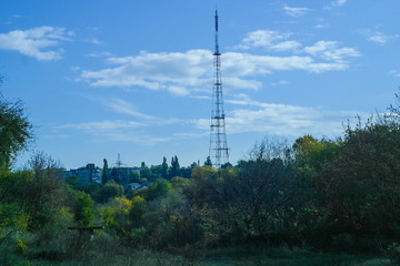 Obraz premium Television tower construction to transmit signals TV. Countryside skyline landscape