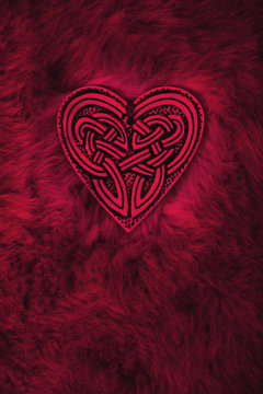 Valentine heart, symbol for love and friendship. Celtic heart lies on a fur rug
