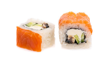 sushi and rolls with different toppings in two pieces close-up on a white background