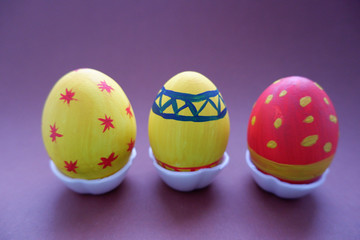 multicolored Easter eggs on a green background