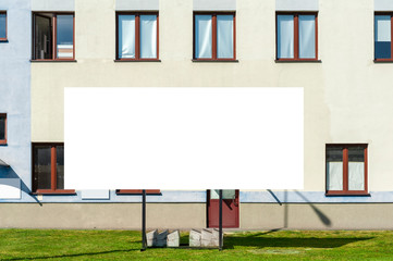 Blank white billboard for advertisement in front of the office building