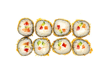 sushi and rolls with different toppings in eight pieces close-up on a white background top view