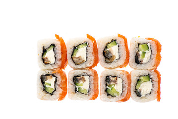 sushi and rolls with different toppings in eight pieces close-up on a white background top view