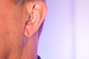 Naklejka premium Man with hearing aid