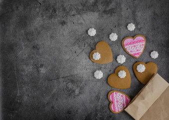 Obraz premium Mother's Day, Valentine's Day, Women's day.Banner of gingerbread hearts on a dark stone background with space for text.Poster for sale in the store.Postcard favorite..Spring festival.copy space.