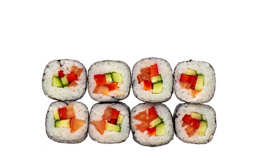 sushi and rolls with different toppings in eight pieces close-up on a white background top view